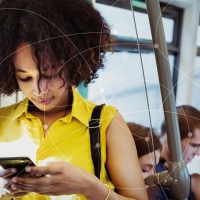 Woman with smart phone on public transportation